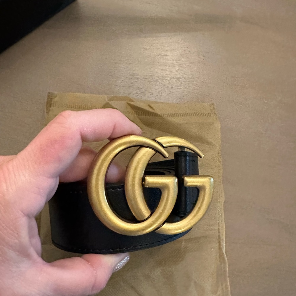 Women’s Black and Gold leather belt size 50/125cm. New price n box